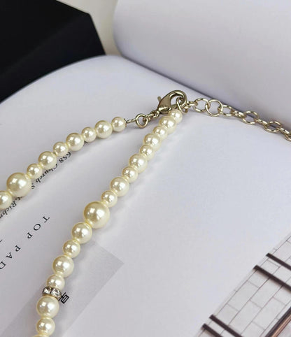 new pearl and diamond logo necklace