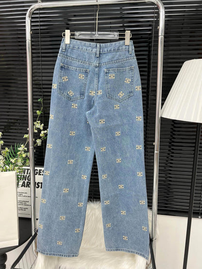 Denim trousers with all-over logo embroidery